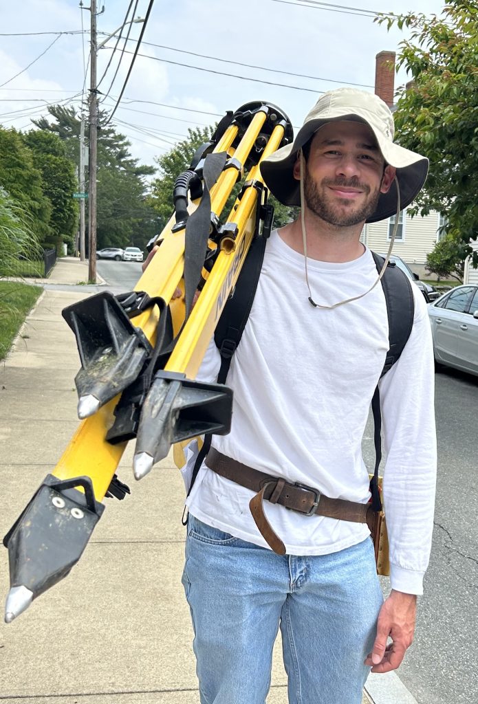 Photo of Ryan Perry, engineering and land survey technician, at Able Engineering Inc., a family-owned business in Little Compton, Rhode Island.